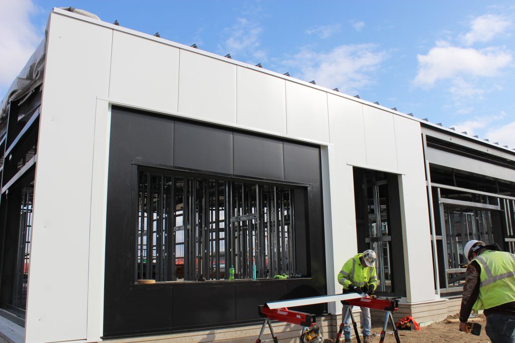 crews work installing BRUCHA metal panels for Go Church in Denver, CO