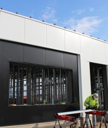 crews work installing BRUCHA metal panels for Go Church in Denver, CO